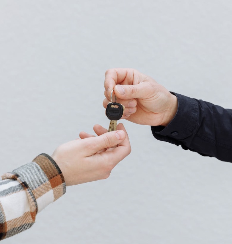 Man gifting a friend a new Volkswagen vehicle.