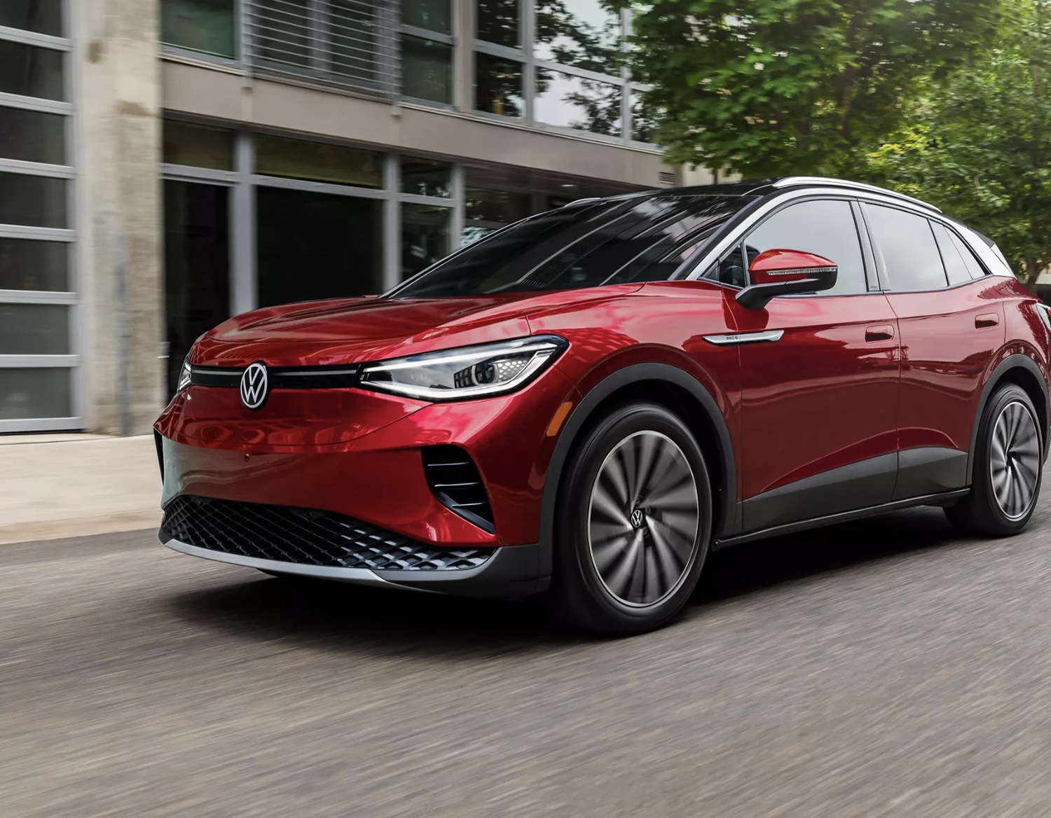 2023 ID.4 in red parked outside of Lou Bachrodt Volkswagen serving Rockford and Elign.