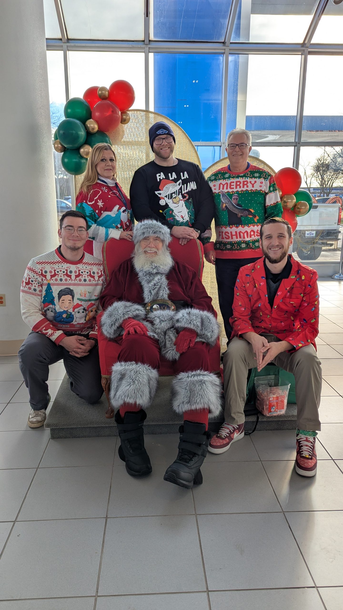 A group of Bachrodt employees sitting with Santa