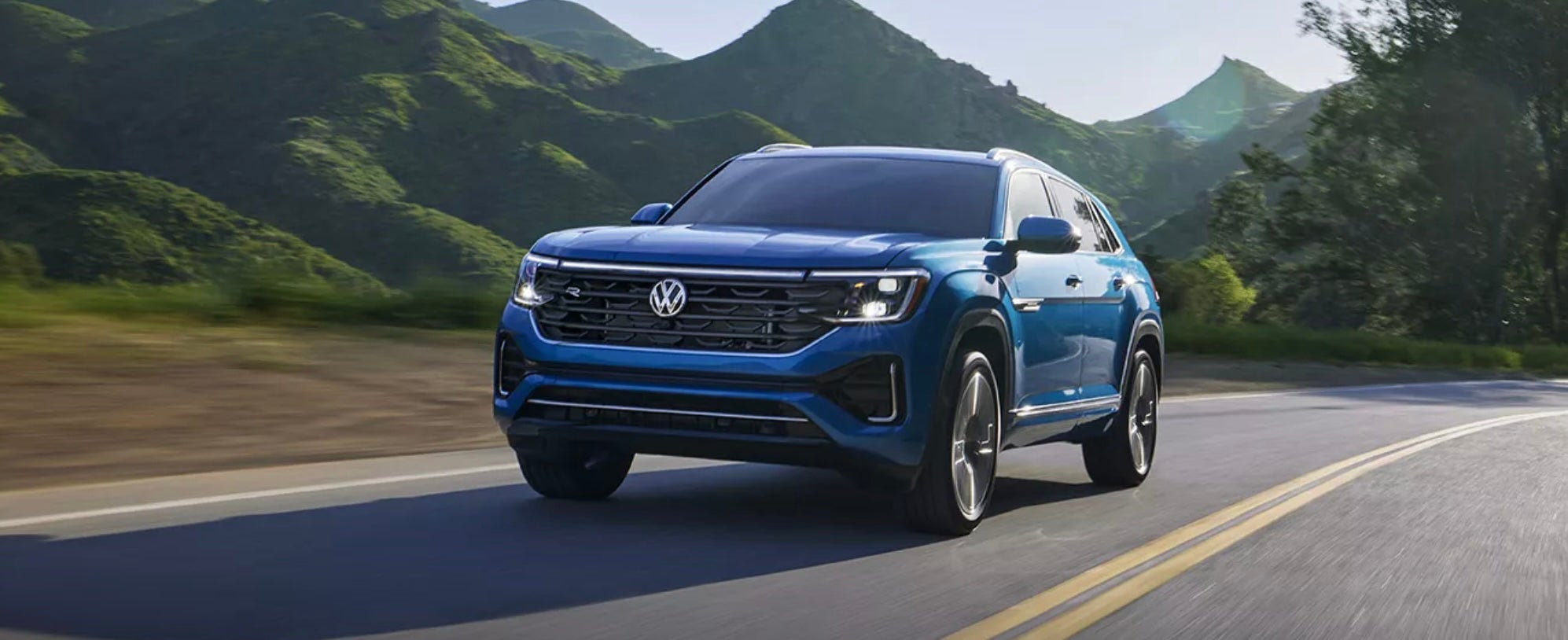 Atlas Cross Sport in blue driving to Elgin, IL